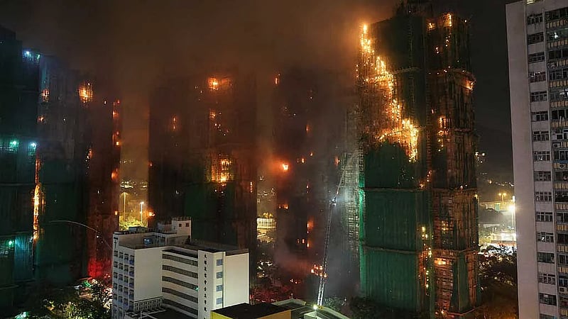 Hong Kong police arrest construction firm bosses over fire; death toll hits 83 with scores missing