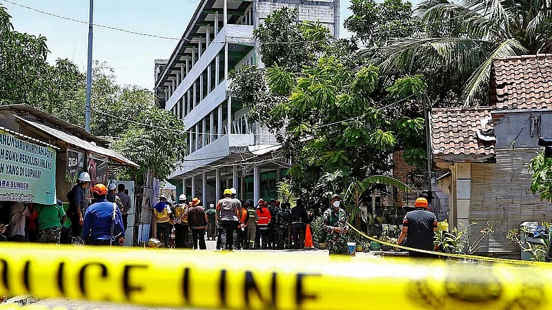 Death toll rises to 9 as rescuers search for trapped Indonesian students