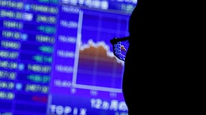Shares skid in Asia as oil, yields stay high