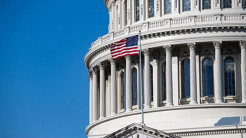 US threatens countries doing business with Iran, but holds off on penalties for now