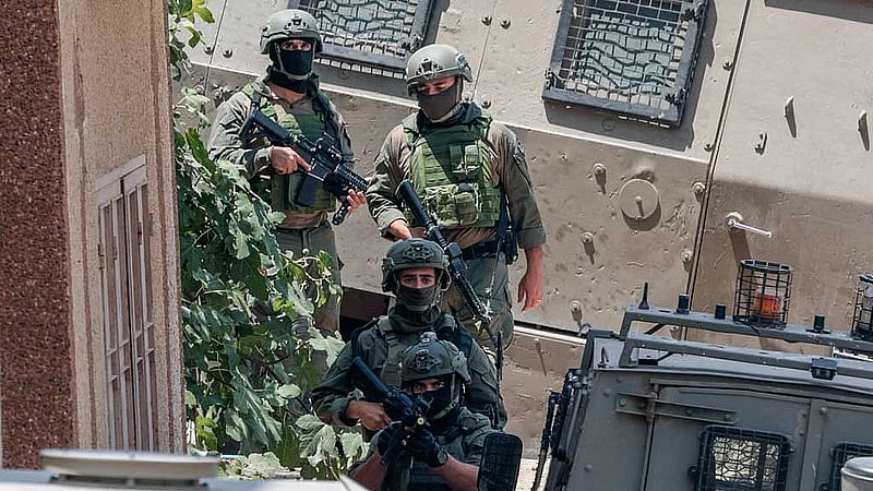 Israeli troops round up Palestinians in West Bank village after shootout involving settlers