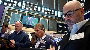 Stocks slide on flare-up in Middle East fighting; oil eases off highs
