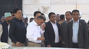Tears pool in Tarique’s eyes as he prays at father’s grave