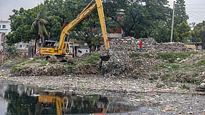 DNCC workers clear a canal