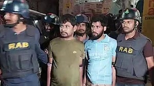 Who are the four people arrested in Mymensingh raid?