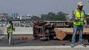 Covered van overturns after tyre burst on Dhaka Elevated Expressway, disrupting traffic