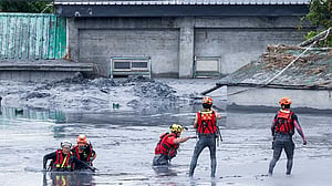 Taiwan rescuers battle thick mud to look for missing from Super Typhoon Ragasa