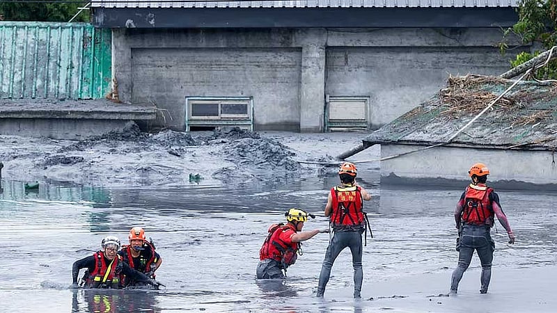 Taiwan rescuers battle thick mud to look for missing from Super Typhoon Ragasa