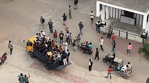 Open-back truck parade through DU blasts parodies celebrating Islamists’ 'election defeat'