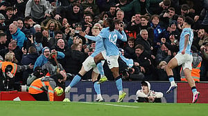 Man City snatch chaotic 2-1 win at Liverpool to stay on Arsenal's heels