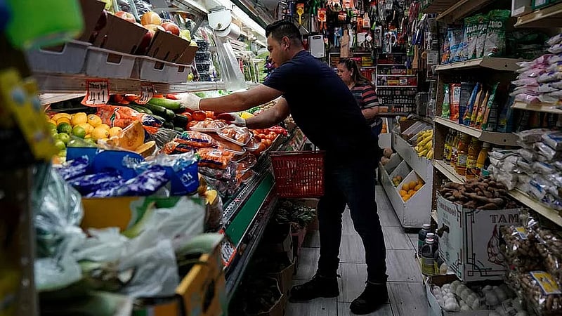 Long lines at the food pantry: Inflation tests Trump’s base in Michigan