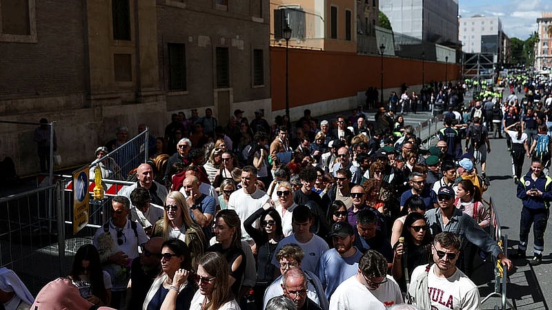 Tens of thousands line up to pay final respects to Pope Francis at the Vatican