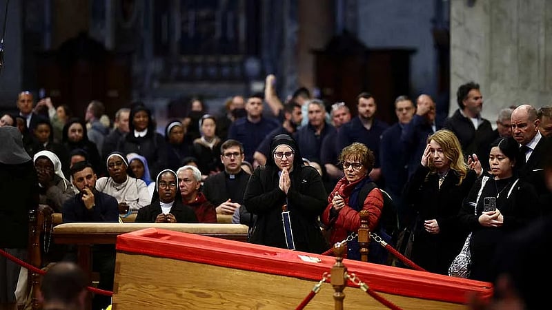 Crowds wait for hours to pay final respects to Pope Francis at St Peter's