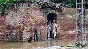 India warns foe Pakistan of potential flooding as both battle torrential rains