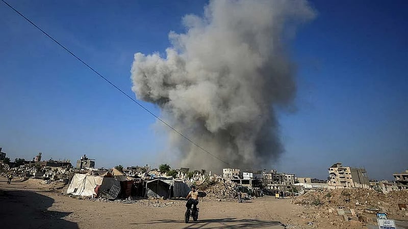 Israel pounds Gaza City suburbs, vows to press on with offensive