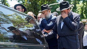 Alleged Bondi gunman charged with 15 murders as funerals of victims begin