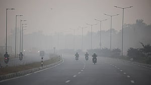 India tightens pollution curbs as Delhi's air quality worsens