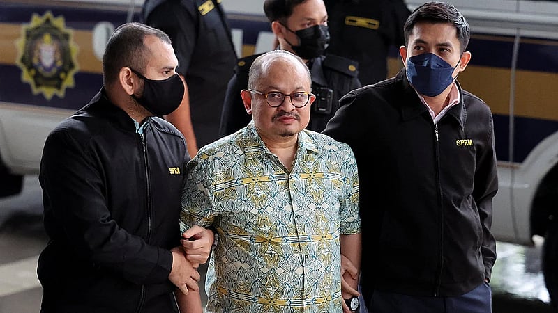 Malaysia charges PM's former aide with receiving bribes