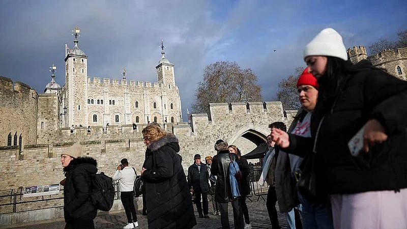 Four arrested at Tower of London after apple crumble and custard thrown at State Crown display