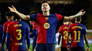 Barcelona edge Rayo to claim top spot with Lewandowski penalty
