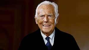 Recovering Giorgio Armani says he will be back in September