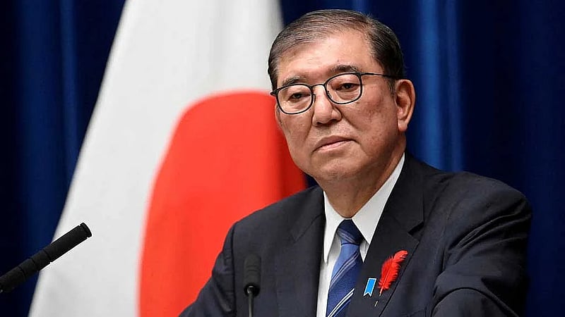 Japan PM vows to stay on after bruising election defeat