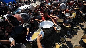 Aid trucks move from Egypt to Gaza after Israel said it began airdrops