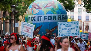 Protesters demand debt cancellation, climate action ahead of UN summit