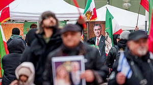 Iran's divided opposition senses its moment but activists remain wary of protests