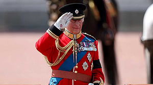 King Charles honours air crash victims at military parade