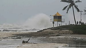 Cyclone Alfred downgraded as millions of Australians stay indoors