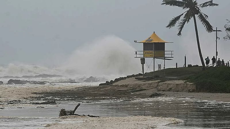 Cyclone Alfred downgraded as millions of Australians stay indoors