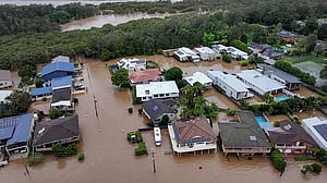 Torrential rain ravages Australian towns, thousands brace for isolation