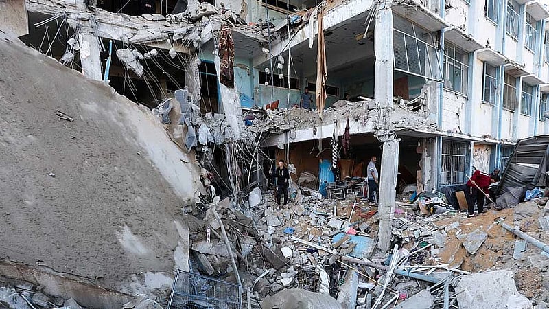 Israeli strikes on school housing displaced and on market kill 48 in Gaza, medics say