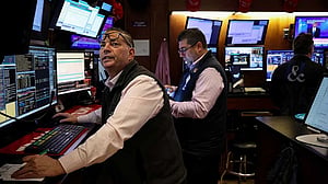 Wall St closes near flat with focus on US-China talks