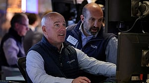Wall Street advances on trade hopes, data shows investor pessimism
