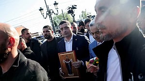 Romanian nationalist Simion seen ahead in election: exit polls