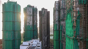 Hong Kong mourns victims of blaze that killed 128 and counting