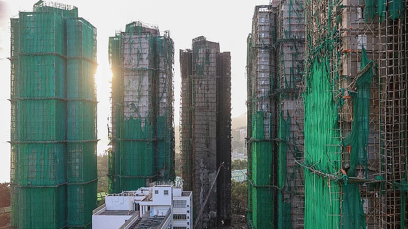 Hong Kong mourns victims of blaze that killed 128 and counting