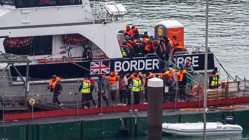 Britain to cut support for some asylum seekers in tougher migration overhaul