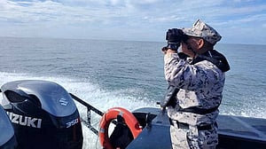 Malaysia searches for 14 missing after migrant boat capsizes