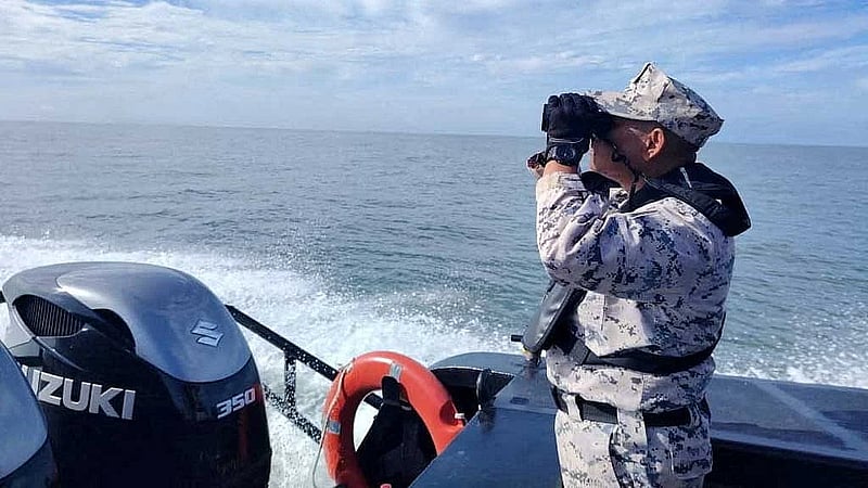 Malaysia searches for 14 missing after migrant boat capsizes