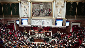 French PM survives no-confidence votes after making pension concession