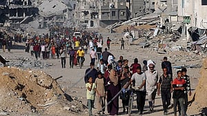 Gazans stream back home as Israel-Hamas ceasefire holds