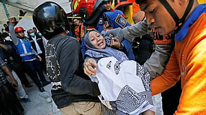 Indonesia earthquake slows efforts to rescue those trapped by school collapse