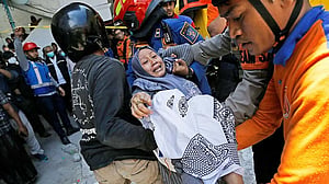 'It seems impossible': Mother's hope for son's life dims after Indonesia school collapse