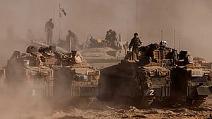 Thousands of Israeli reservists report for duty, as military chief clashes with ministers