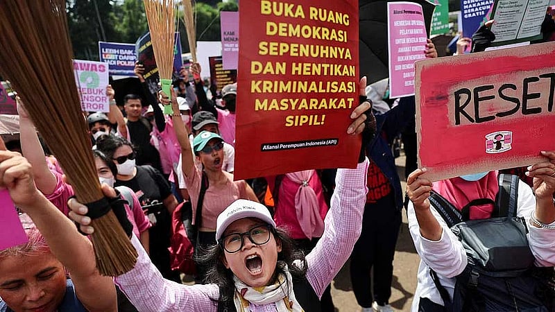 With brooms in hand as symbol for change, Indonesian women join Jakarta protests