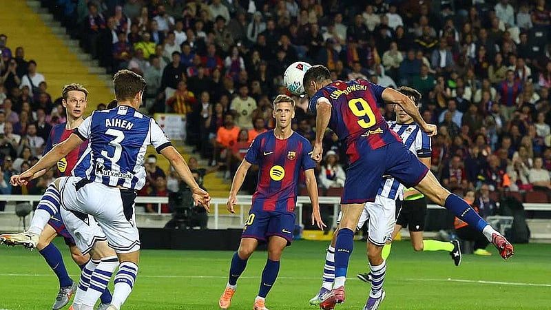Barcelona go top with 2-1 win over Real Sociedad