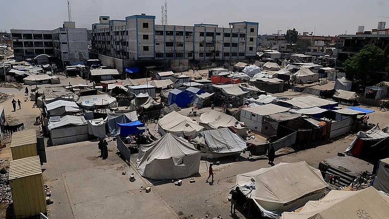 Israeli military tells Gaza City residents to leave, bombs high-rise tower